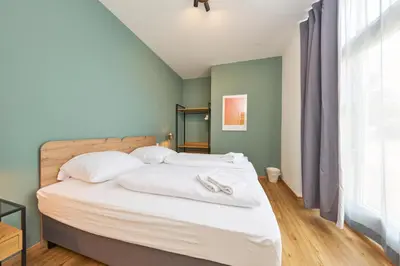 Ein Bett oder Betten in einem Zimmer der Unterkunft COZEE - Design-Wohnung mit Parkplatz zwischen München und Flughafen MUC