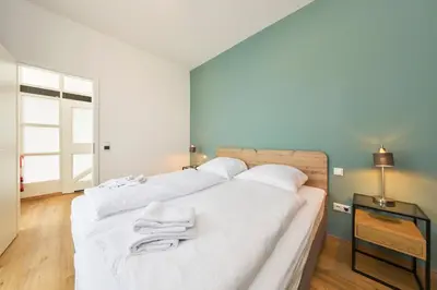 Ein Bett oder Betten in einem Zimmer der Unterkunft COZEE - Design-Wohnung mit Parkplatz zwischen München und Flughafen MUC