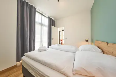 Ein Bett oder Betten in einem Zimmer der Unterkunft COZEE - Design-Wohnung mit Parkplatz zwischen München und Flughafen MUC