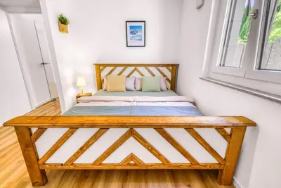 Ein Bett oder Betten in einem Zimmer der Unterkunft Stilvoll - Heimkino, Kochinsel, Parkplatz, Neubau & Mehr