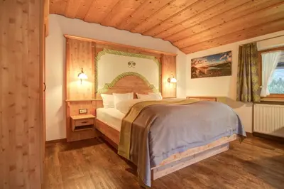 Ein Bett oder Betten in einem Zimmer der Unterkunft Ferienwohnungen Kimpfbeck, Kreuth-Schärfen