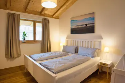 Ein Bett oder Betten in einem Zimmer der Unterkunft Ferienwohnung Waldzeit