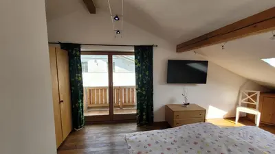 Ein Bett oder Betten in einem Zimmer der Unterkunft Chiemsee-Fewo Prien