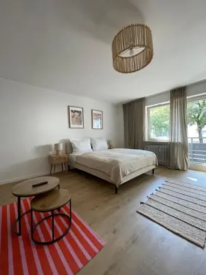 Ein Bett oder Betten in einem Zimmer der Unterkunft NEU - Apartment Lago am Chiemsee