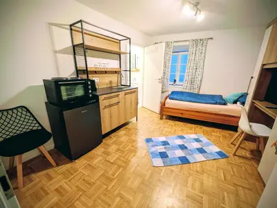 Ein Bett oder Betten in einem Zimmer der Unterkunft Allgäuer Hof Weilheim