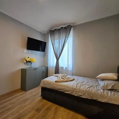 Ein Bett oder Betten in einem Zimmer der Unterkunft Boardinghouse Naim