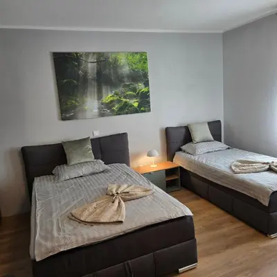 Ein Bett oder Betten in einem Zimmer der Unterkunft Boardinghouse Naim