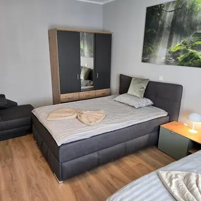 Ein Bett oder Betten in einem Zimmer der Unterkunft Boardinghouse Naim