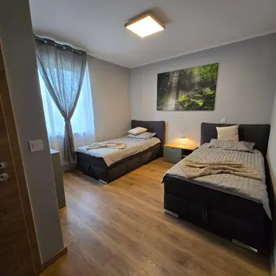 Ein Bett oder Betten in einem Zimmer der Unterkunft Boardinghouse Naim