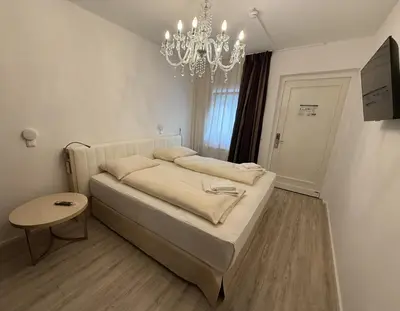 Ein Bett oder Betten in einem Zimmer der Unterkunft Boutique-Hotel Goethe