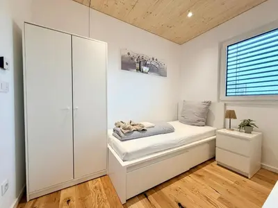 Ein Bett oder Betten in einem Zimmer der Unterkunft Chalet du calme Gersthofen