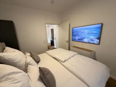 Ein Bett oder Betten in einem Zimmer der Unterkunft Brand new luxury apartment on Rathausplatz