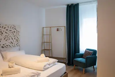 Ein Bett oder Betten in einem Zimmer der Unterkunft ღLiboria I Casa Mangifera