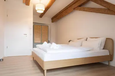 Ein Bett oder Betten in einem Zimmer der Unterkunft ღLiboria Das Blaue Haus