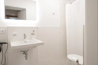 Ein Badezimmer in der Unterkunft ღLiboria Das Blaue Haus
