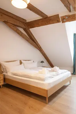 Ein Bett oder Betten in einem Zimmer der Unterkunft ღLiboria Das Blaue Haus