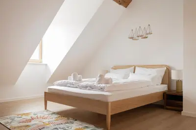 Ein Bett oder Betten in einem Zimmer der Unterkunft ღLiboria Casa Mondo