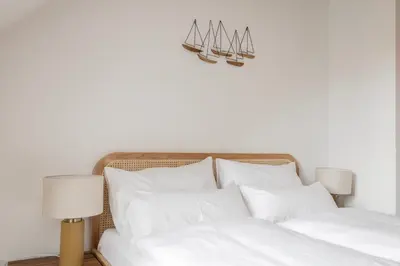 Ein Bett oder Betten in einem Zimmer der Unterkunft ღLiboria Casa Mondo