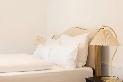 Ein Bett oder Betten in einem Zimmer der Unterkunft ღLiboria Villa Münter