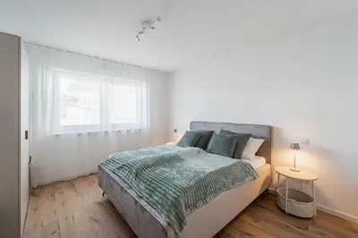Ein Bett oder Betten in einem Zimmer der Unterkunft Bay 47° Boutique Apartments am Chiemsee