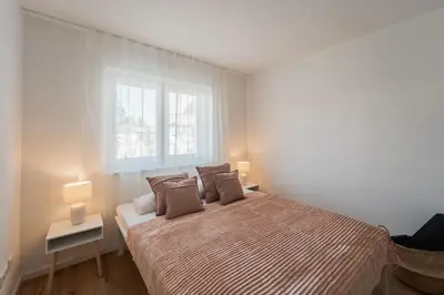 Ein Bett oder Betten in einem Zimmer der Unterkunft Bay 47° Boutique Apartments am Chiemsee