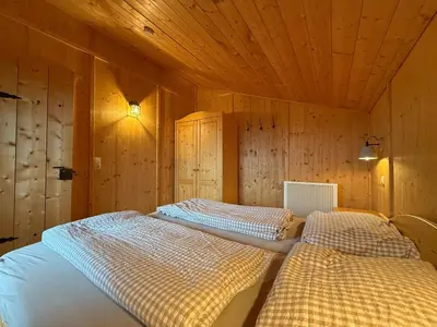 Ein Bett oder Betten in einem Zimmer der Unterkunft Langegger Alm - Sennerstube