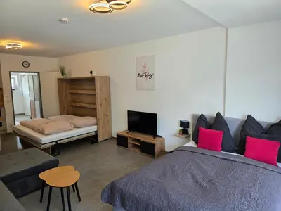 Ein Bett oder Betten in einem Zimmer der Unterkunft Modernes Apartment in guter Lage Deluxe