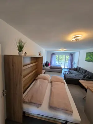 Ein Bett oder Betten in einem Zimmer der Unterkunft Modernes Apartment in guter Lage Deluxe