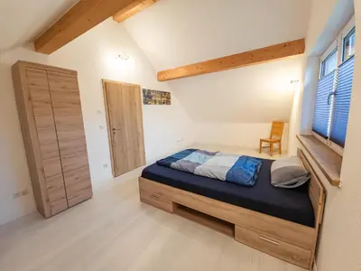 Ein Bett oder Betten in einem Zimmer der Unterkunft Schöne Dachgeschosswohnung