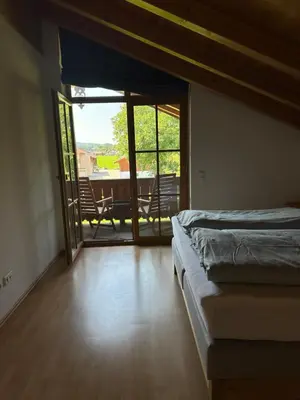Ein Bett oder Betten in einem Zimmer der Unterkunft Ferienwohnung Obstgartenblick