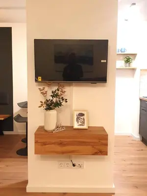 TV/Unterhaltungsangebot in der Unterkunft Rosels Mountain Lodge-Pool, Sauna & Kaiserblick-Balkon Ferienwohnung in Oberaudorf Bayern