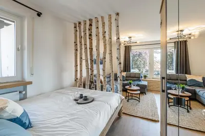Ein Bett oder Betten in einem Zimmer der Unterkunft Rosels Mountain Lodge-Pool, Sauna & Kaiserblick-Balkon Ferienwohnung in Oberaudorf Bayern