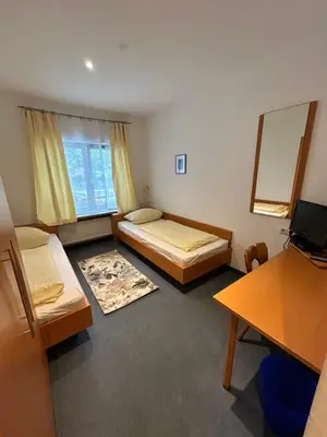 Ein Bett oder Betten in einem Zimmer der Unterkunft Gästezimmer im Trenner