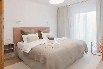 Ein Bett oder Betten in einem Zimmer der Unterkunft Design-Apartment am Chiemsee
