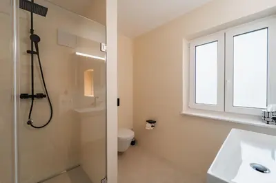 Ein Badezimmer in der Unterkunft Bay 12° Boutique Apartment am Chiemsee