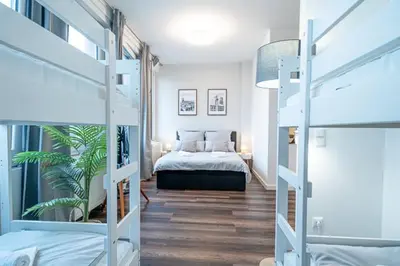 Ein Bett oder Betten in einem Zimmer der Unterkunft 1 Modernes City-Studio für 6 Bogenhausen Nähe Messe