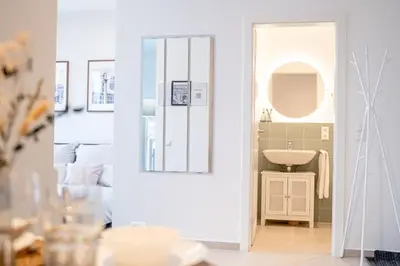 Ein Badezimmer in der Unterkunft 1 Modernes City-Studio für 6 Bogenhausen Nähe Messe