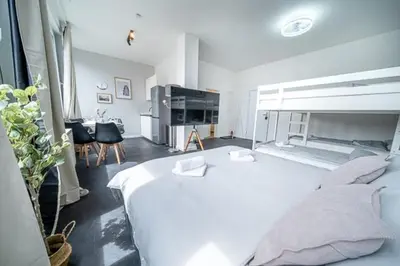 Ein Bett oder Betten in einem Zimmer der Unterkunft 3 Modern city studio for 6 Bogenhausen near Messe Munich