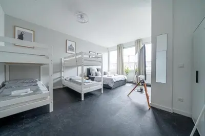 Ein Bett oder Betten in einem Zimmer der Unterkunft 3 Modern city studio for 6 Bogenhausen near Messe Munich