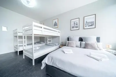Ein Bett oder Betten in einem Zimmer der Unterkunft 3 Modern city studio for 6 Bogenhausen near Messe Munich