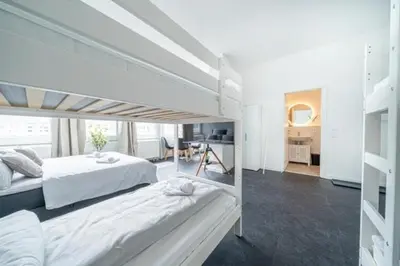 Ein Bett oder Betten in einem Zimmer der Unterkunft 3 Modern city studio for 6 Bogenhausen near Messe Munich
