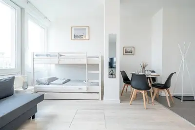 Ein Bett oder Betten in einem Zimmer der Unterkunft 4 Modern city studio for 7 Bogenhausen near Messe Munich