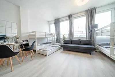 Ein Bett oder Betten in einem Zimmer der Unterkunft 7 Modern city studio for 7 Bogenhausen near Messe Munich
