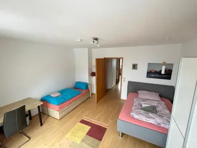 Ein Bett oder Betten in einem Zimmer der Unterkunft Grosses Haus bei München mit 4 Schlafzimmern für bis zu 10 Personen