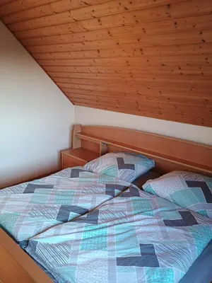 Ein Bett oder Betten in einem Zimmer der Unterkunft Ganze Wohnung mit Balkon, bis 5 Personen rund 90 qm