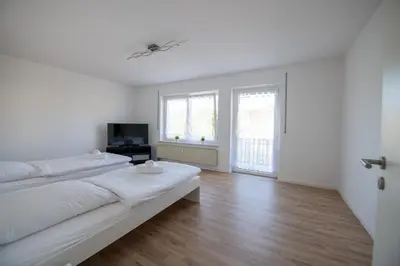 Ein Bett oder Betten in einem Zimmer der Unterkunft W&P Living Wohnung mit Balkon Parkplatz