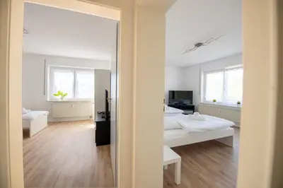 Ein Bett oder Betten in einem Zimmer der Unterkunft W&P Living Wohnung mit Balkon Parkplatz