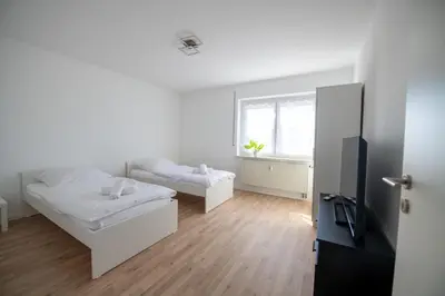 Ein Bett oder Betten in einem Zimmer der Unterkunft W&P Living Wohnung mit Balkon Parkplatz