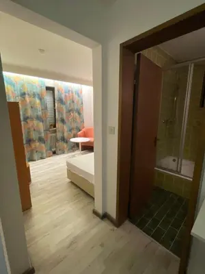 Ein Bett oder Betten in einem Zimmer der Unterkunft Pension De Lux Rain