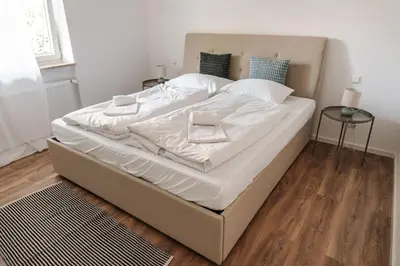 Ein Bett oder Betten in einem Zimmer der Unterkunft Skyrise Apartments in Bad Wörishofen - zentral & modern